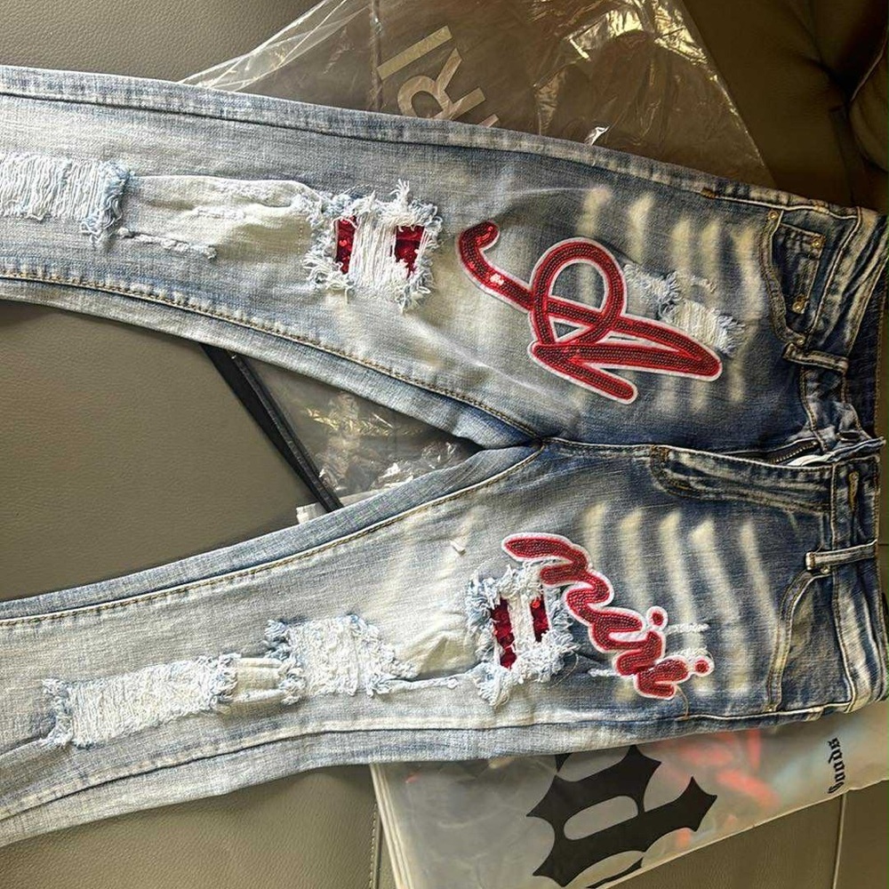 AMIRI Light Blue Distressed Jeans with Red Details
